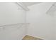 A walk-in closet features tiled floor and metal shelving at 5608 Pinnacle Heights Cir # 305, Tampa, FL 33624