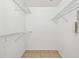 A walk-in closet features tiled floor and metal shelving at 5608 Pinnacle Heights Cir # 305, Tampa, FL 33624