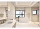 Spa-like bathroom with a freestanding tub and ocean view at 10126 Gulf Blvd # Ph3, Treasure Island, FL 33706