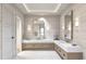 Luxurious bathroom with double vanity and herringbone tile floor at 10126 Gulf Blvd # Ph3, Treasure Island, FL 33706
