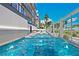 Relaxing pool and spa area with lounge chairs at 10126 Gulf Blvd # Ph3, Treasure Island, FL 33706