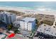Aerial view showcasing building's location and proximity to the beach at 10126 Gulf Blvd # Ph3, Treasure Island, FL 33706