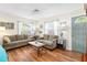 Relaxing living room with hardwood floors and neutral-toned sofas at 6030 62Nd N St, St Petersburg, FL 33709