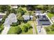 Aerial view of a property with two houses, solar panels, and a boat at 6030 62Nd N St, St Petersburg, FL 33709