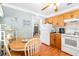 Cozy kitchen with a dining area and light wood cabinets at 6030 62Nd N St, St Petersburg, FL 33709