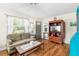 Bright living room featuring hardwood floors and a wood entertainment center at 6030 62Nd N St, St Petersburg, FL 33709