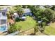 Large backyard with spacious lawn, patio furniture, and shed at 6030 62Nd N St, St Petersburg, FL 33709