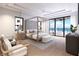 Spacious bedroom with a canopy bed and ocean views at 10126 Gulf Blvd # Ph4, Treasure Island, FL 33706