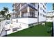 Outdoor patio area with seating, firepit, and dog park at 10126 Gulf Blvd # Ph4, Treasure Island, FL 33706