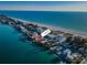 Property location shown via aerial view; beachfront home near the water at 10126 Gulf Blvd # Ph4, Treasure Island, FL 33706