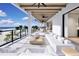 Relaxing oceanfront balcony with seating and stunning ocean views at 10126 Gulf Blvd # Ph4, Treasure Island, FL 33706