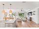 Bright and airy kitchen with a large island overlooking the dining area and living room at 11828 Ranchers Gap Dr, Odessa, FL 33556