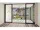 Enclosed sunroom with sliding glass doors and outdoor views, perfect for relaxing at 14130 Rosemary Ln # 2208, Largo, FL 33774