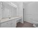 Bathroom boasts a vanity with mirror and toilet at 18001 Richmond Place Dr # 122, Tampa, FL 33647