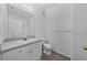 Clean bathroom with white vanity and gray flooring at 18001 Richmond Place Dr # 122, Tampa, FL 33647