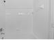 Clean bathroom with white tile shower/tub combo at 18001 Richmond Place Dr # 122, Tampa, FL 33647