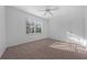 Bright bedroom with window, ceiling fan and carpet at 18001 Richmond Place Dr # 122, Tampa, FL 33647