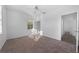 Spacious bedroom with neutral carpet and large window at 18001 Richmond Place Dr # 122, Tampa, FL 33647