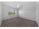 Spacious bedroom with large window and ceiling fan at 18001 Richmond Place Dr # 122, Tampa, FL 33647