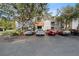 Condo building exterior with parking lot and landscaping at 18001 Richmond Place Dr # 122, Tampa, FL 33647