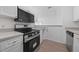 Modern kitchen with stainless steel appliances and light cabinets at 18001 Richmond Place Dr # 122, Tampa, FL 33647