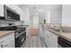 Modern kitchen with stainless steel appliances and light wood cabinets at 18001 Richmond Place Dr # 511, Tampa, FL 33647