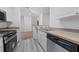Modern kitchen with stainless steel appliances and light wood cabinets at 18001 Richmond Place Dr # 511, Tampa, FL 33647