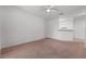 Spacious living room with neutral carpet and ceiling fan at 18001 Richmond Place Dr # 511, Tampa, FL 33647