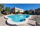 Community pool with surrounding patio and lounge chairs at 225 Country Club Dr # D140, Largo, FL 33771