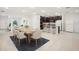 Open-concept living space featuring a dining area, kitchen with an island, and a living room at 4013 Chadwick Ave, Spring Hill, FL 34609