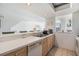 Well-lit kitchen with an open design, offering views to the living room and dining area at 651 Garland Cir, Indian Rocks Beach, FL 33785