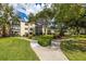 Lakeview of Largo 55+ community with lush landscaping and a welcoming entrance at 14130 Rosemary Ln # 2208, Largo, FL 33774