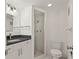 Modern bathroom with granite countertop and shower at 14130 Rosemary Ln # 2208, Largo, FL 33774