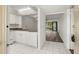 Bright kitchen with white cabinets and granite countertops at 14130 Rosemary Ln # 2208, Largo, FL 33774