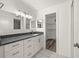 Modern bathroom with granite vanity and updated fixtures at 14130 Rosemary Ln # 2208, Largo, FL 33774