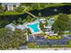 Aerial view of community pool, shuffleboard, and BBQ area at 14130 Rosemary Ln # 2208, Largo, FL 33774