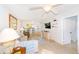 Bright living room with light flooring, comfy sofa, and built-in shelving at 1619 Mission Hills Blvd, Clearwater, FL 33759