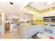 Bright kitchen with white cabinets and appliances at 1619 Mission Hills Blvd, Clearwater, FL 33759