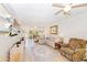 Living room with sectional sofa and access to patio at 1619 Mission Hills Blvd, Clearwater, FL 33759
