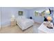 Cozy bedroom with light walls and a comfortable bed at 1619 Mission Hills Blvd, Clearwater, FL 33759