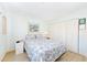 Simple bedroom with light walls and a comfortable bed at 1619 Mission Hills Blvd, Clearwater, FL 33759