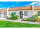 Exterior view of a condo with landscaped garden at 1619 Mission Hills Blvd, Clearwater, FL 33759