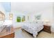 Relaxing bedroom with light walls and a comfortable bed at 1619 Mission Hills Blvd, Clearwater, FL 33759