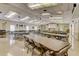 Large community room with tables and chairs for gatherings at 1619 Mission Hills Blvd, Clearwater, FL 33759
