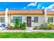 Exterior view of a condo with landscaped garden at 1619 Mission Hills Blvd, Clearwater, FL 33759