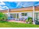 Relax on this condo's private patio with seating and planters at 1619 Mission Hills Blvd, Clearwater, FL 33759