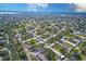 Aerial view of community featuring numerous buildings and lush landscaping at 1619 Mission Hills Blvd, Clearwater, FL 33759