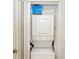 Convenient laundry closet with stackable washer and dryer at 1619 Mission Hills Blvd, Clearwater, FL 33759