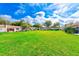 Aerial view of community featuring lush green lawn and building exteriors at 1619 Mission Hills Blvd, Clearwater, FL 33759