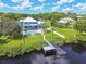 Aerial view of waterfront property, showcasing the house, pool, and private dock at 8107 Sierra Manor Ln, Tampa, FL 33635